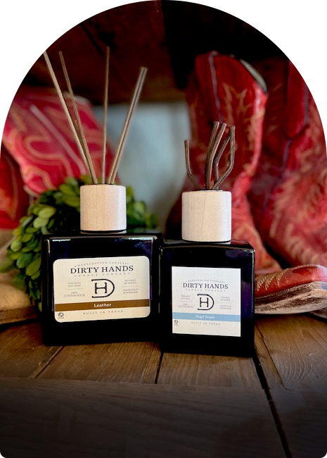 Two bottles of reed diffuser elegantly placed on a wooden table, showcasing their decorative design and soothing scents.