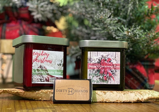 A Red and Green Christmas Candle under a Tree