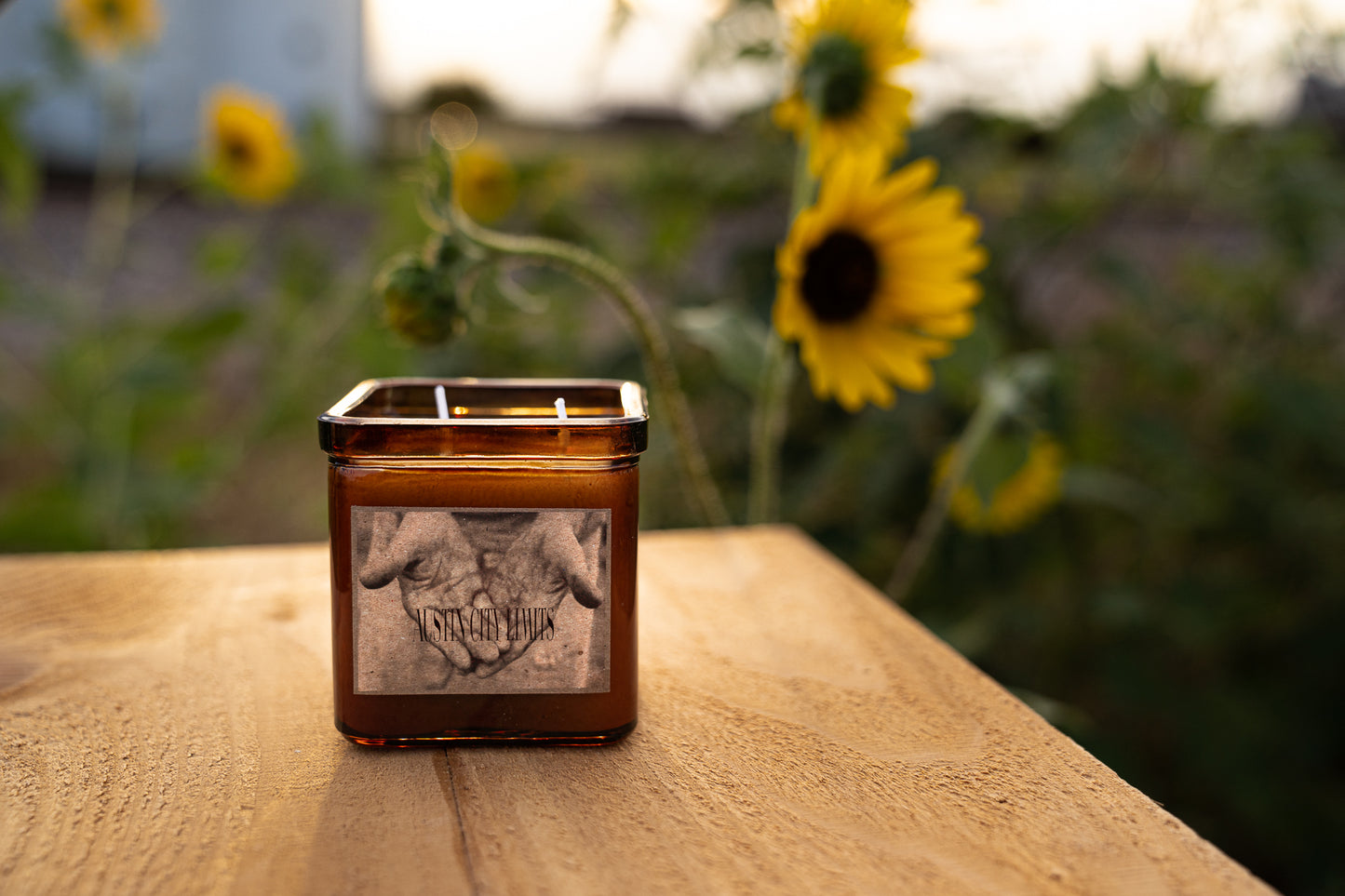 A 9oz square candle sitting on a table