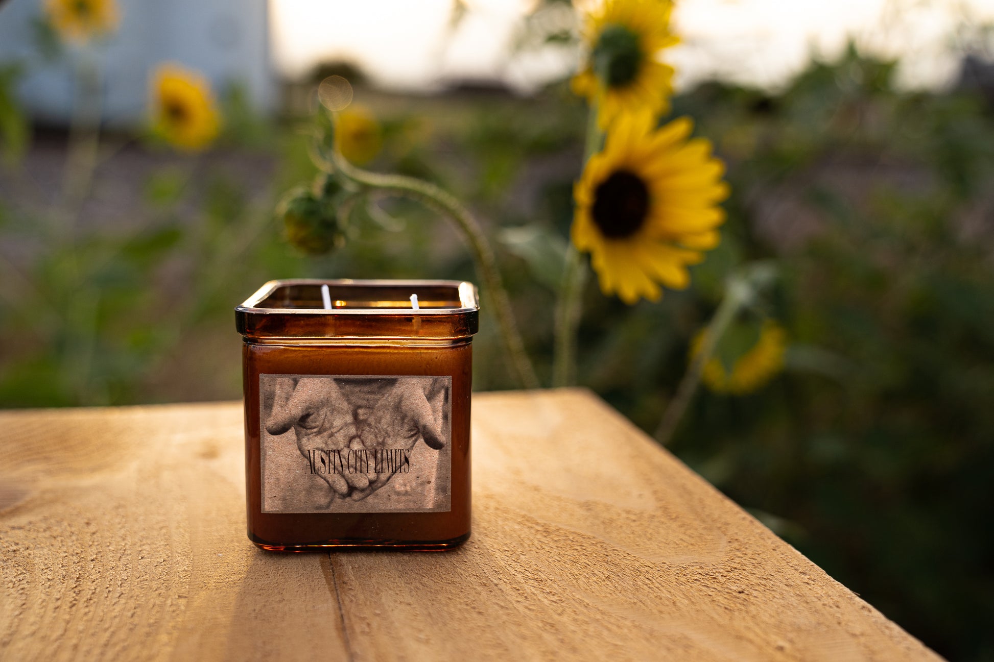 A 9oz square candle sitting on a table